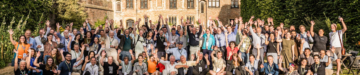 Attendees pose for group photo at Trinity College