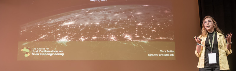 Clara speaking at Arctic Repair. Presentation reads: A just path forward