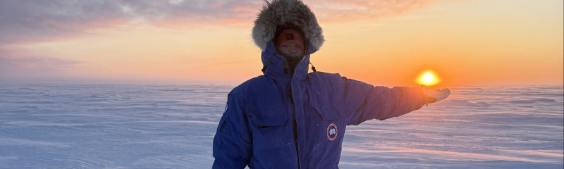 Faye holding the sun in the Arctic