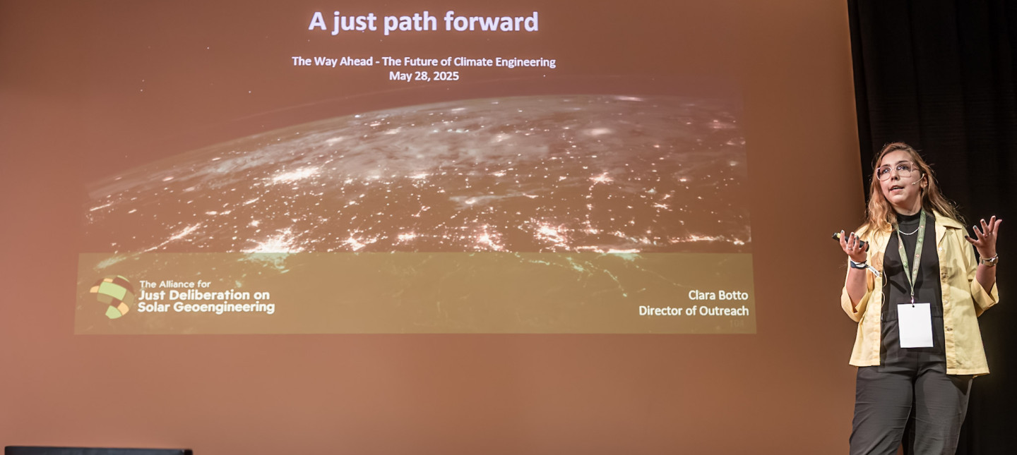 Clara speaking at Arctic Repair. Presentation reads: A just path forward