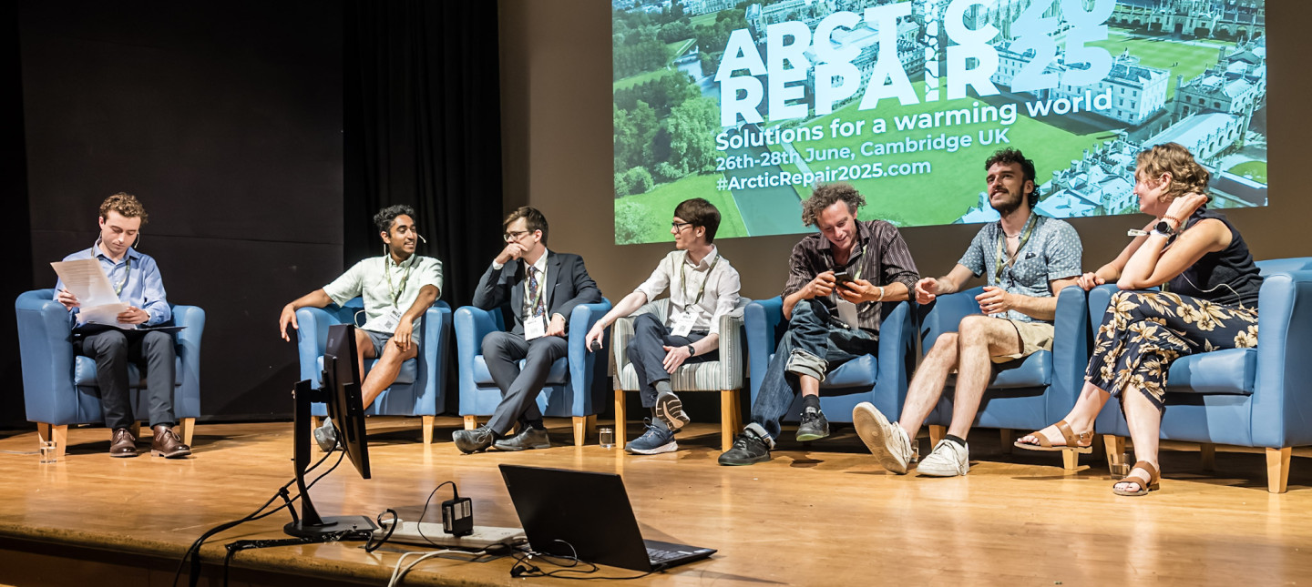 Early-career researchers in armchairs on stage at Arctic Repair