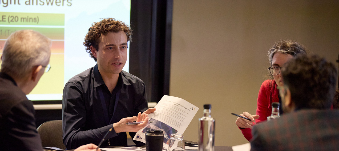 Group discussion at a table with paper