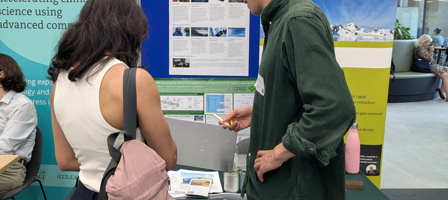 Two people at an exhibition stand