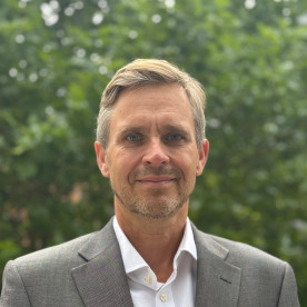 Ian facing the camera, smiling