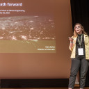 Clara speaking at Arctic Repair. Presentation reads: A just path forward