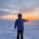 Faye holding the sun in the Arctic