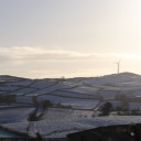 Wind turbine on snowy field