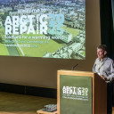 Shaun on stage at conference
