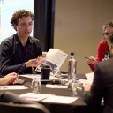 Group discussion at a table with paper