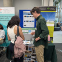 Two people at an exhibition stand