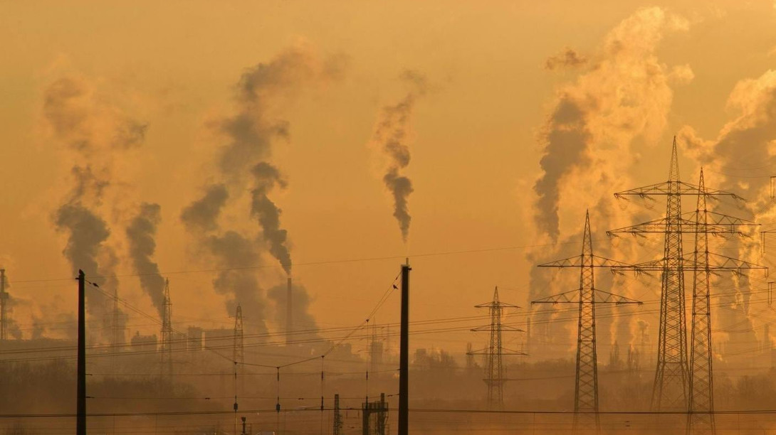 Electric pylons and smoke emissions during golden hour. Free image from Pexels