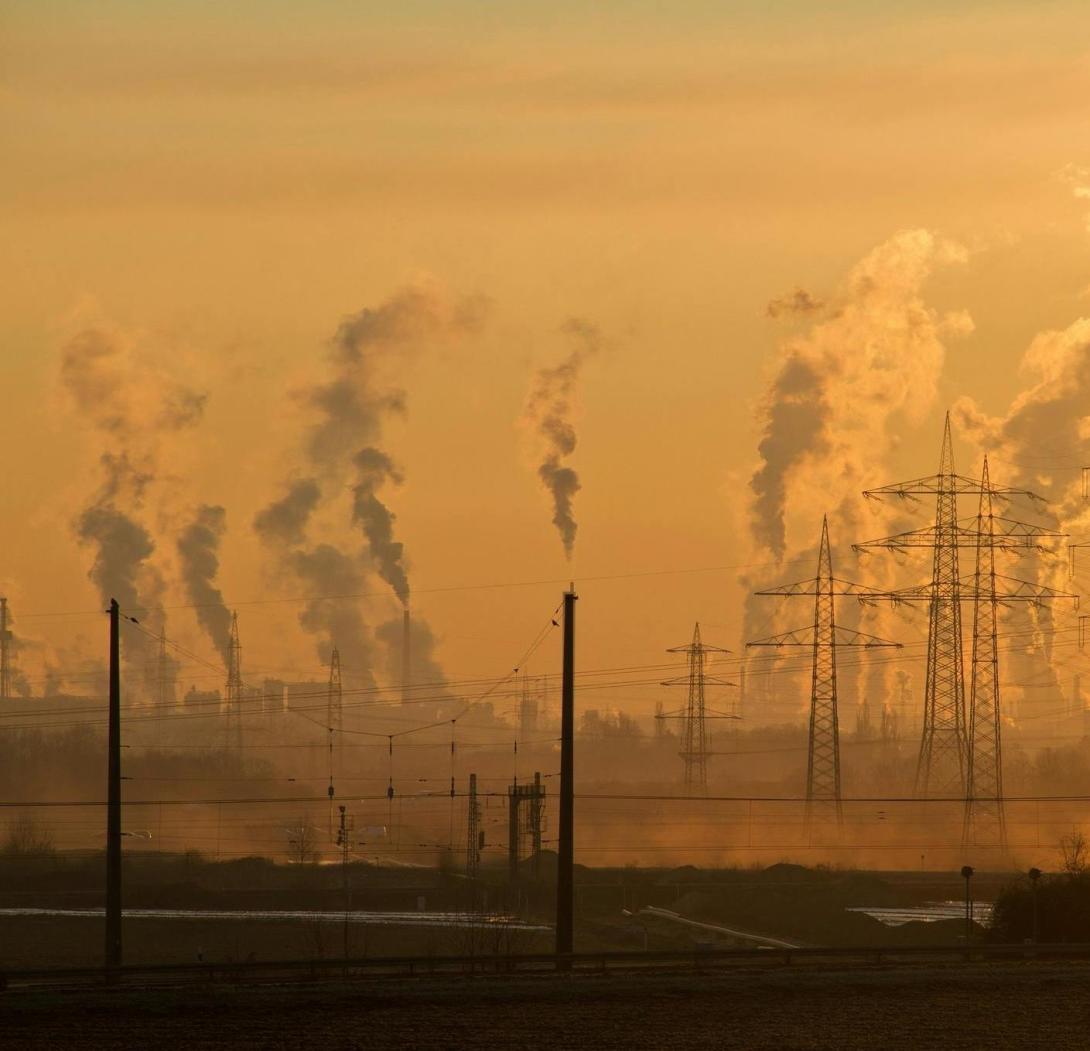 Electric pylons and smoke emissions during golden hour. Free image from Pexels