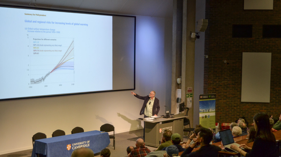 Robert pointing to a graph on the screen