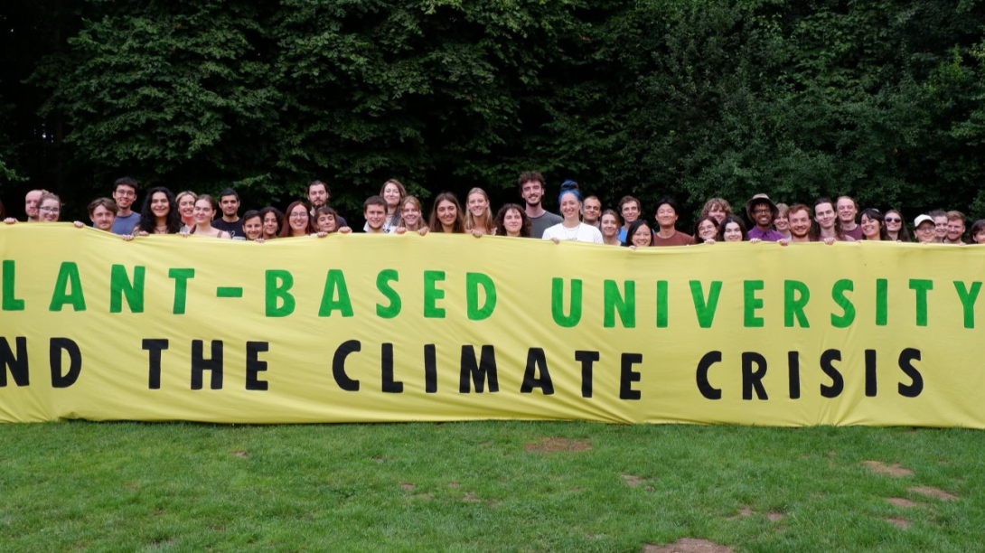 Plant-Based Universities members with banner