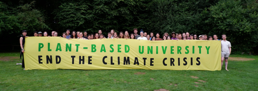 Plant-Based Universities members with banner