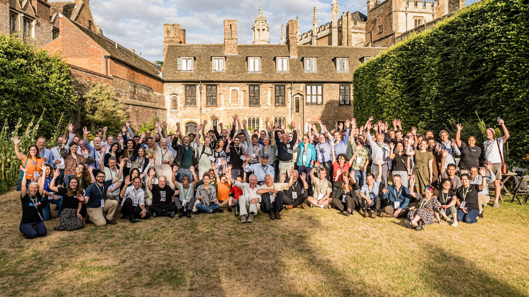 Attendees pose for group photo at Trinity College