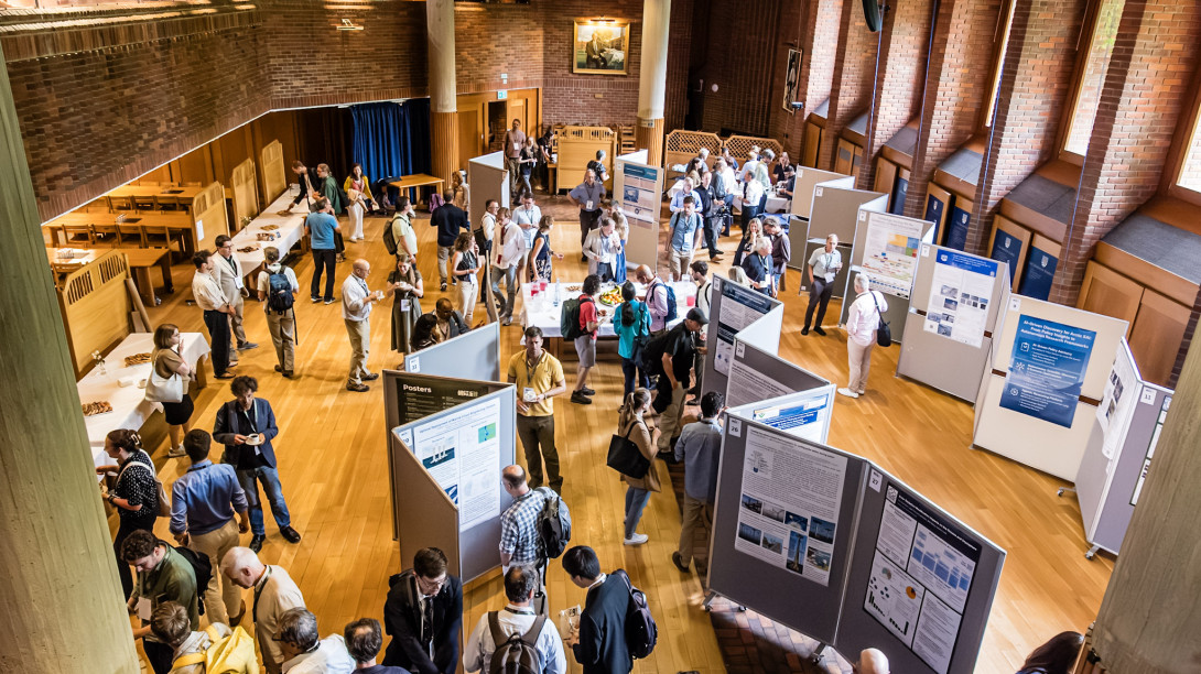 Dining hall full of posters and people