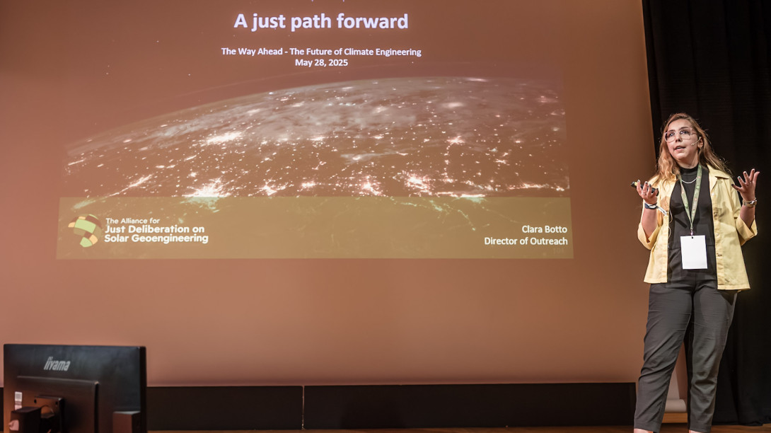 Clara speaking at Arctic Repair. Presentation reads: A just path forward