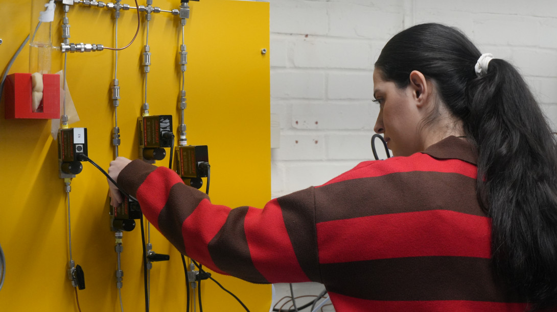 Researcher testing equipment in the lab
