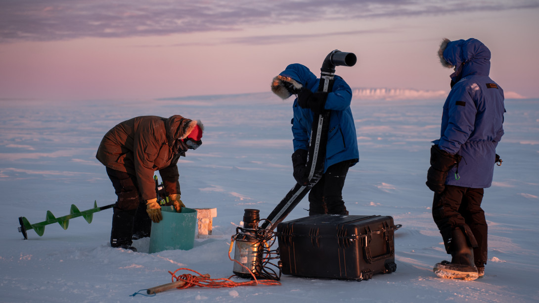 Researchers in the Arctic operating equipment