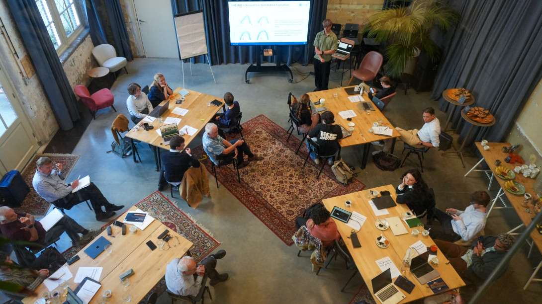 People around tables, view from above